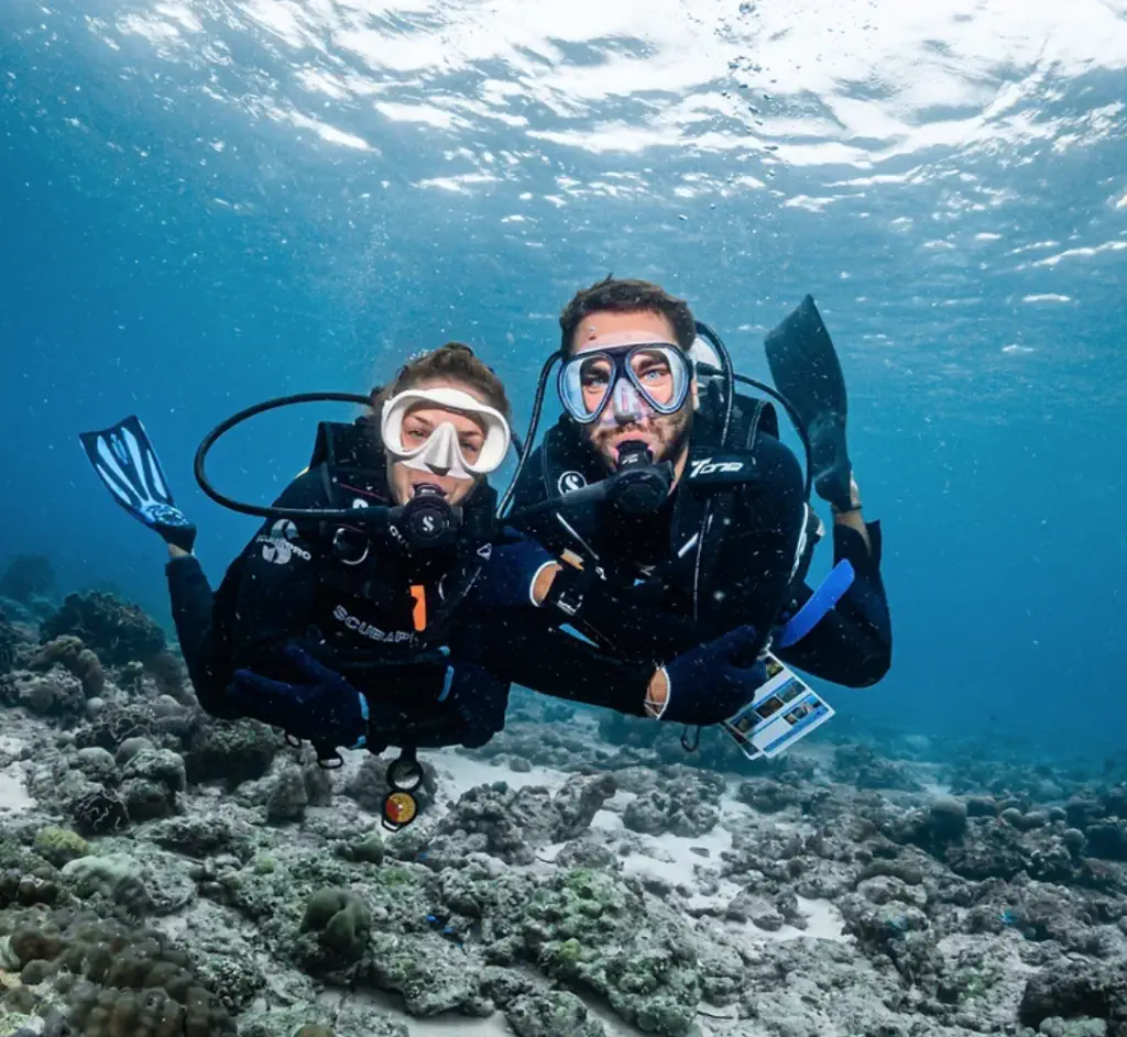 Scuba diver exploring the Tevana House Reef in Bira, South Sulawesi